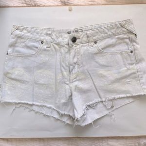 Free People Cutoff Denim Shorts in Light Gray with White Pattern